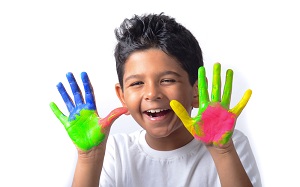 kid with colors in hand